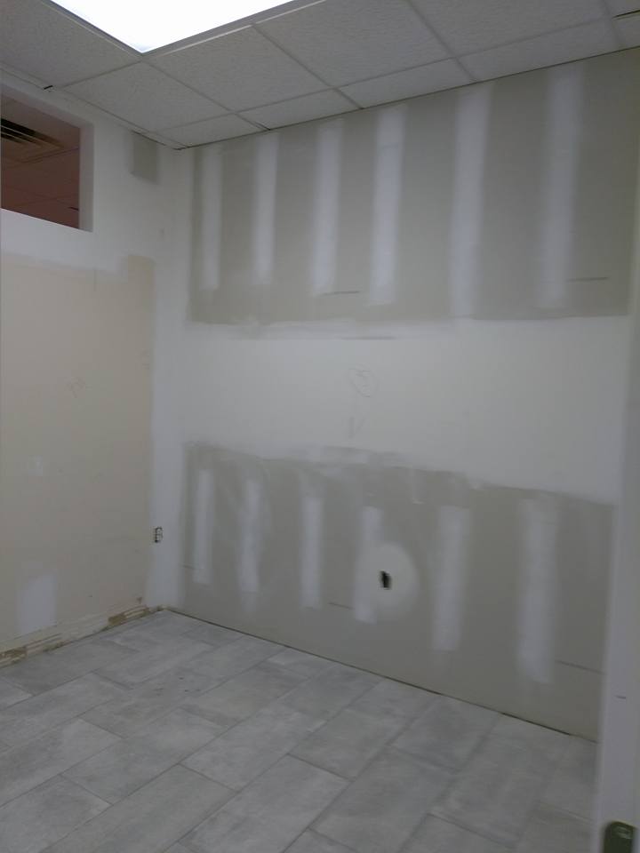 Large wall that has new drywall waiting for primer.