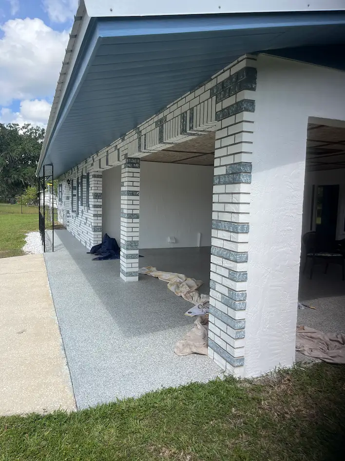 Freshly spray painted wide soffit on front of house.