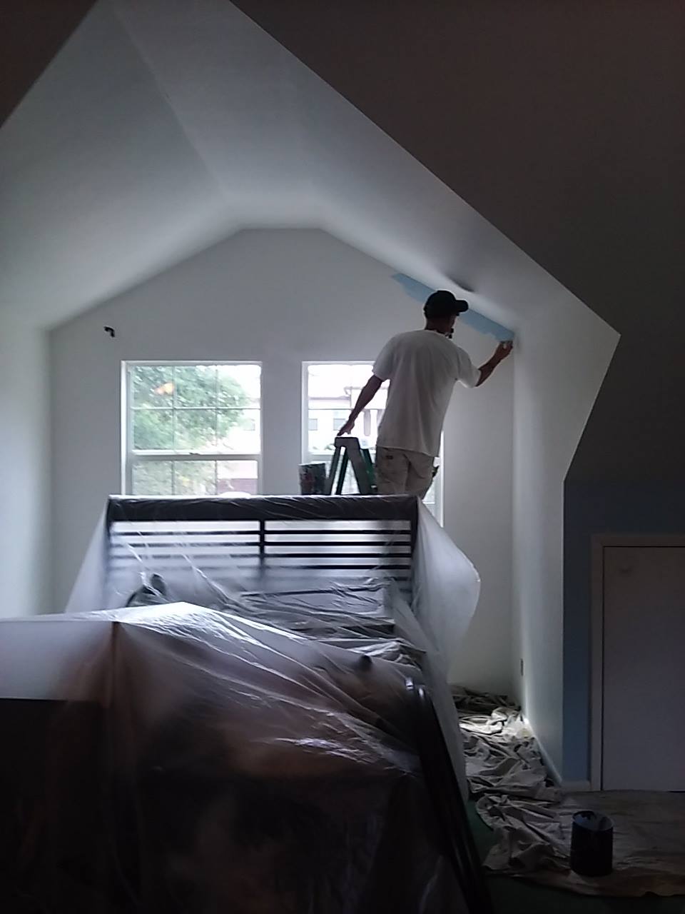 Cutting in interior paint lines for crisp edges